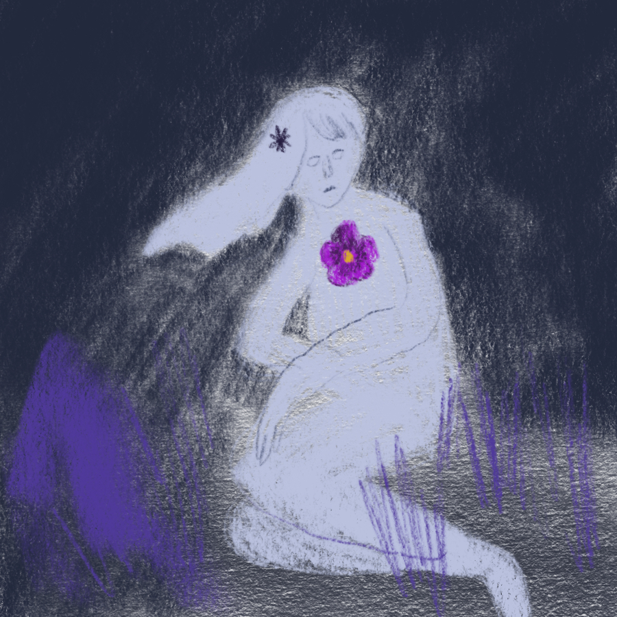 woman sitting among purple grass at night with a flower on her chest and in her long, flowing hair