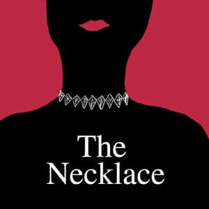 silhouette of a woman wearing an ornate necklace